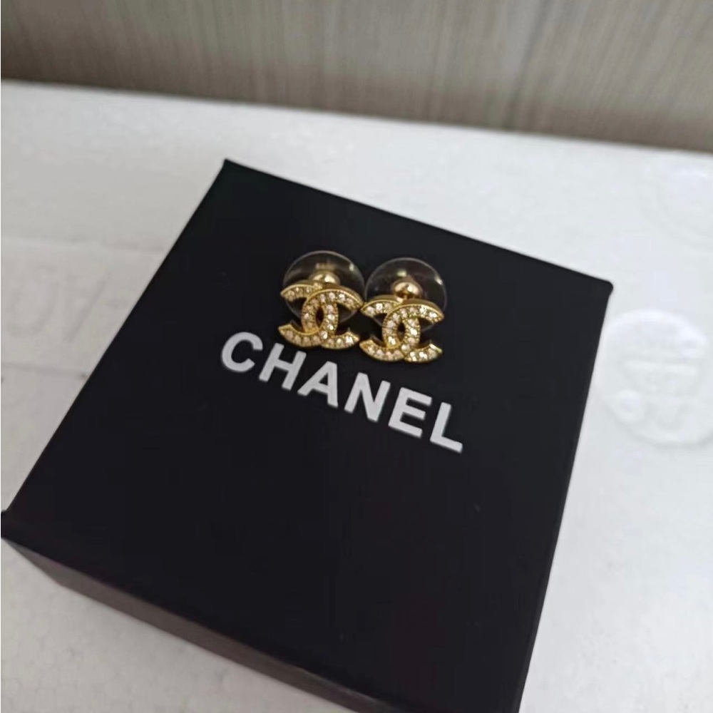 CHANEL Gold Logo Earrings